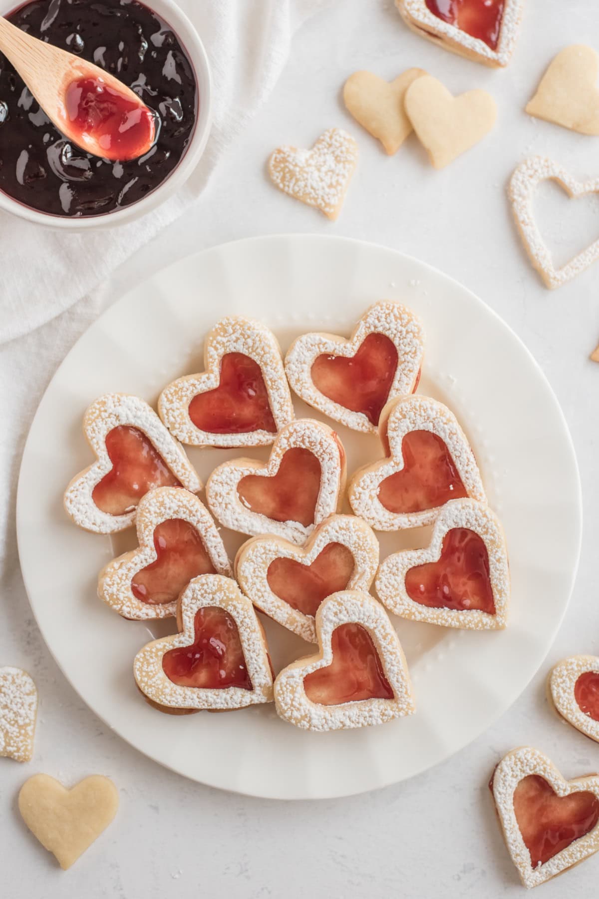 linzer heart cookies on a white plate