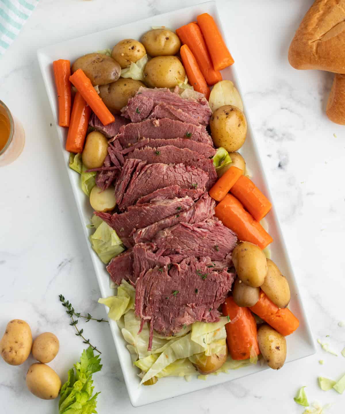Slow Cooked Corned Beef and Cabbage is an easy, tender, and flavorful St. Patrick’s Day dinner made with brisket and hearty vegetables. overhead shot of corned beef and cabbage on platter