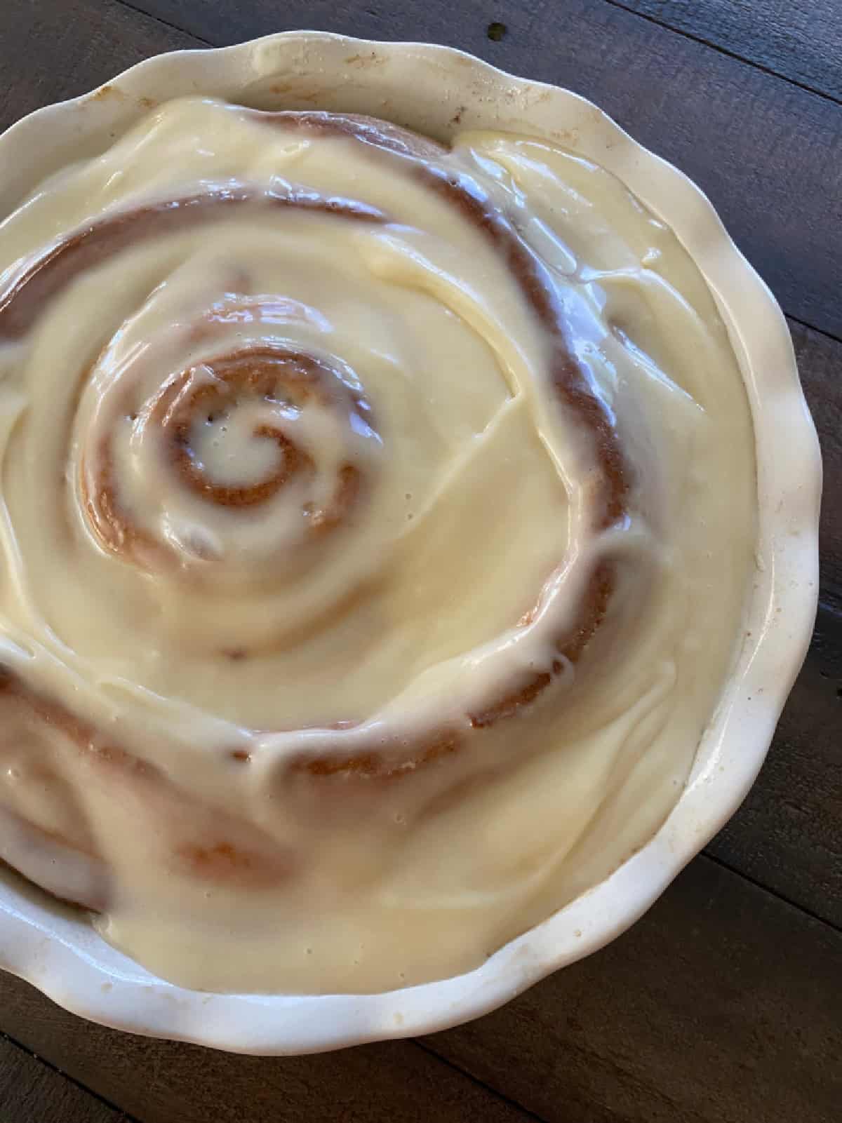 giant cinnamon roll in a pie pan
