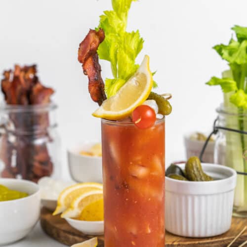loaded bloody mary in a glass with garnishments