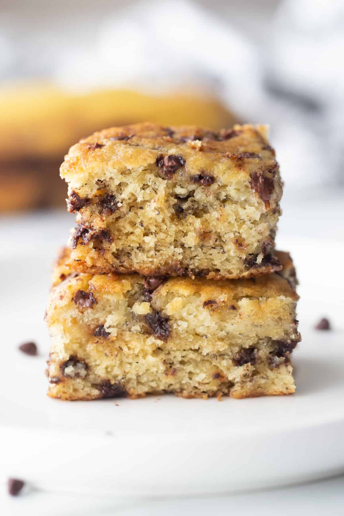 two slices of chocolate chip banana snack cake stacked on top of each other
