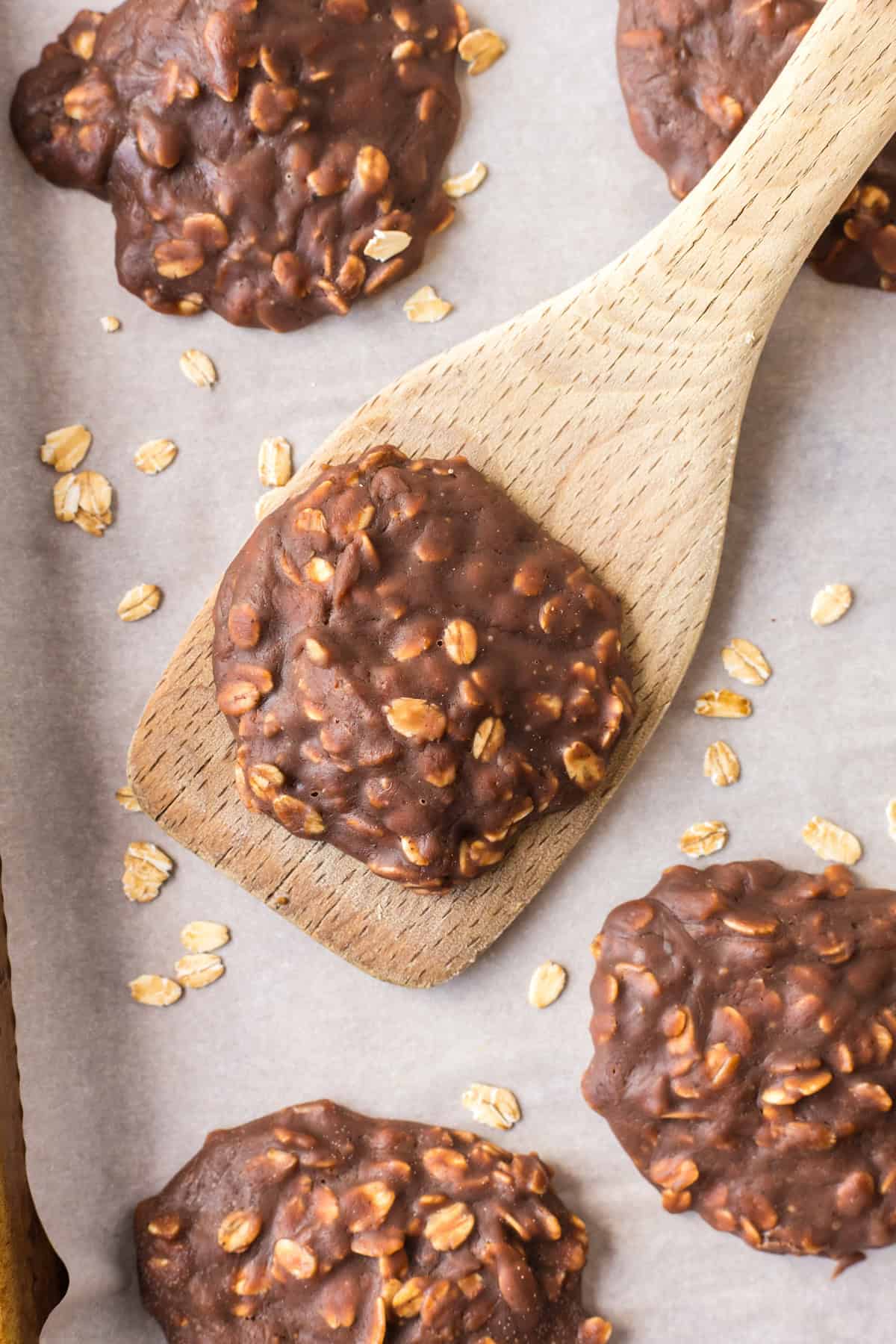Chocolate peanut butter no bake cookies made with oats and cocoa. Easy, fudgy and perfect for a no-oven summer dessert! spatula with a chocolate peanut butter no bake cookie